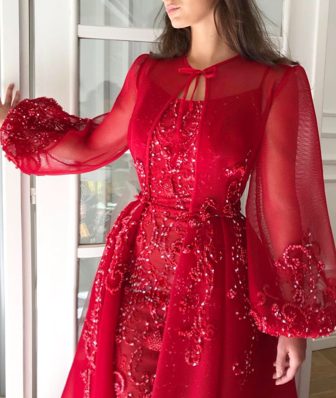 Red overskirt dress with long sleeves and embroidery