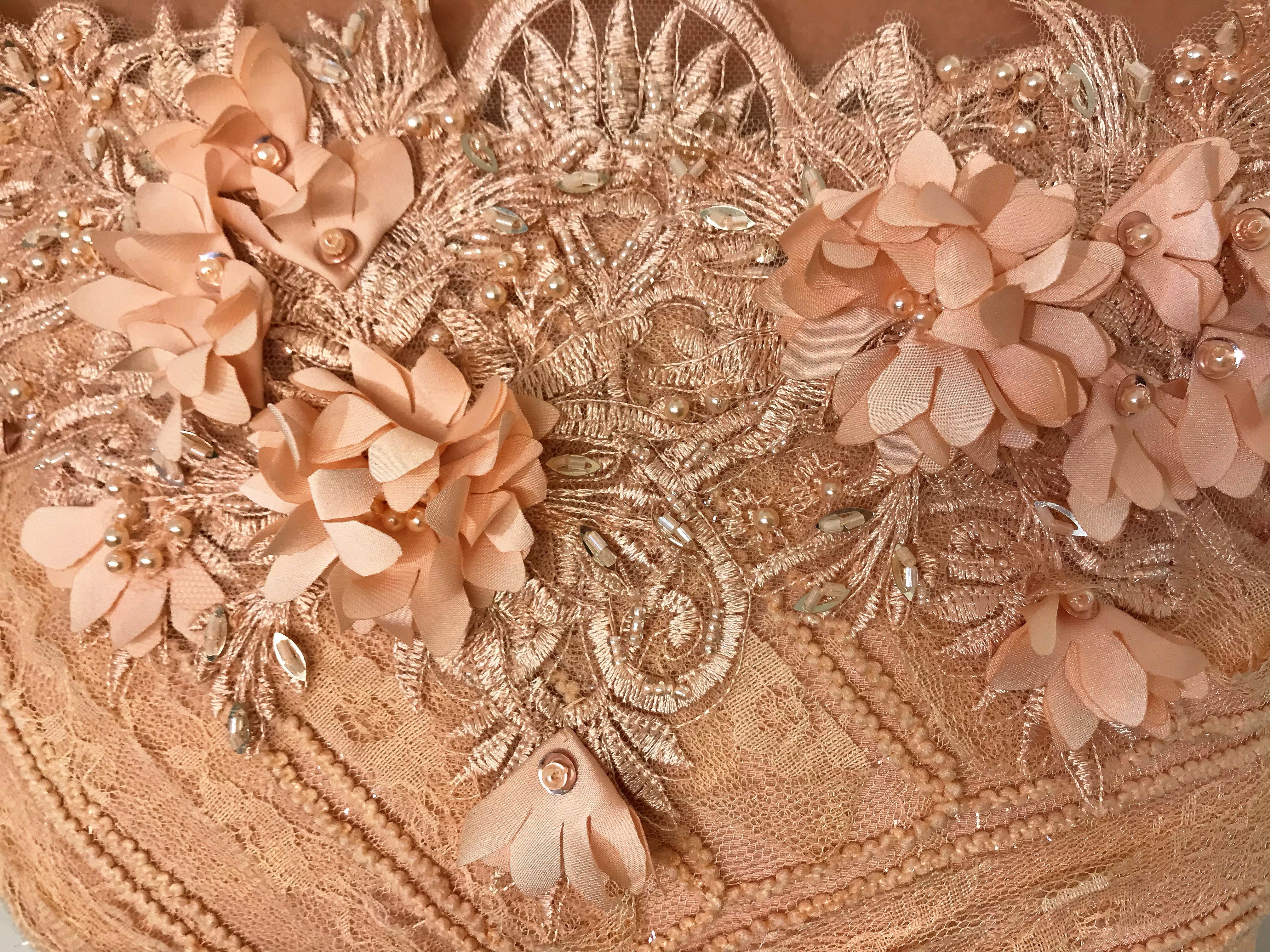 Pink A-Line dress with long off the shoulder sleeves and embroidery
