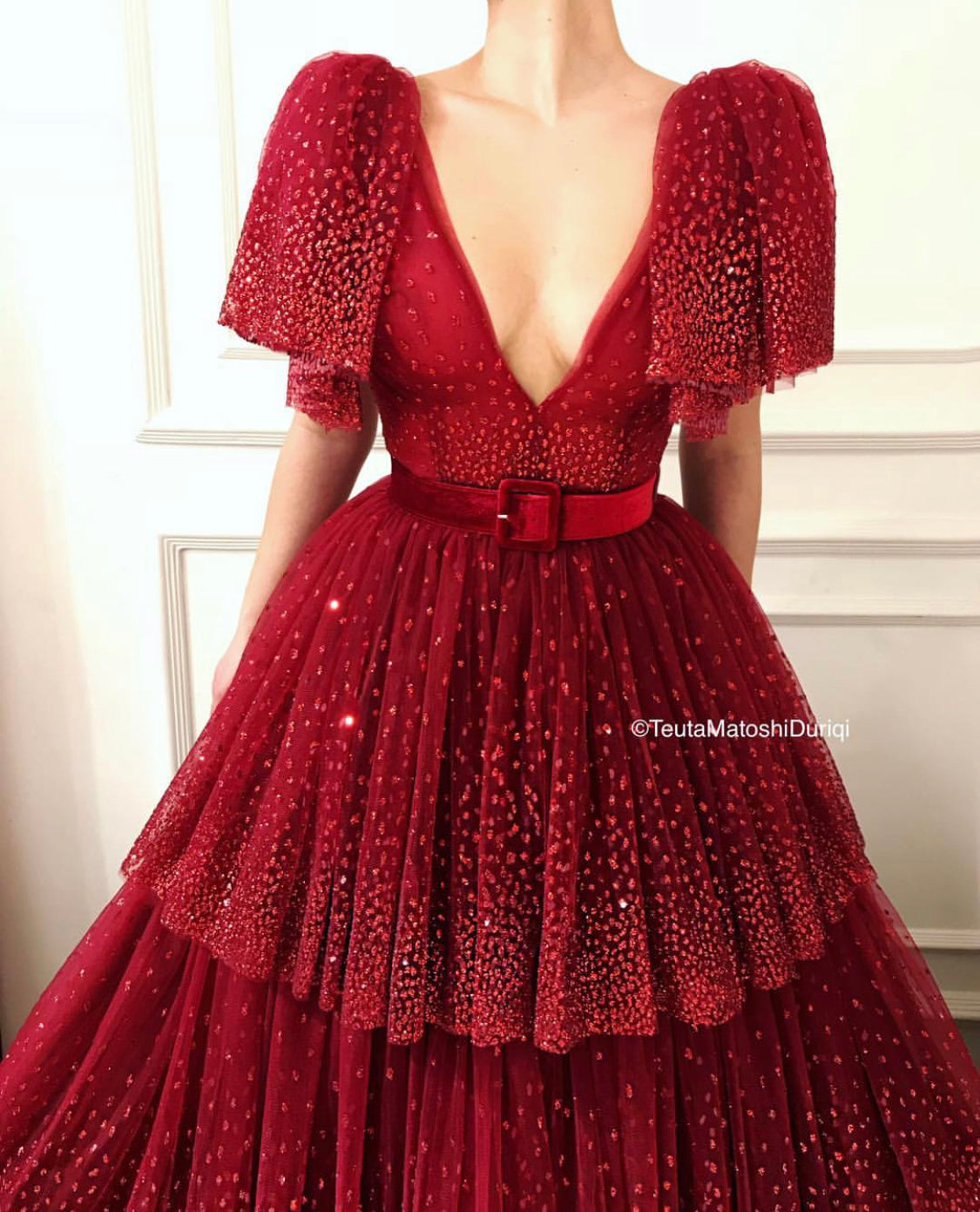 Red A-Line dress with v-neck, short sleeves and belt