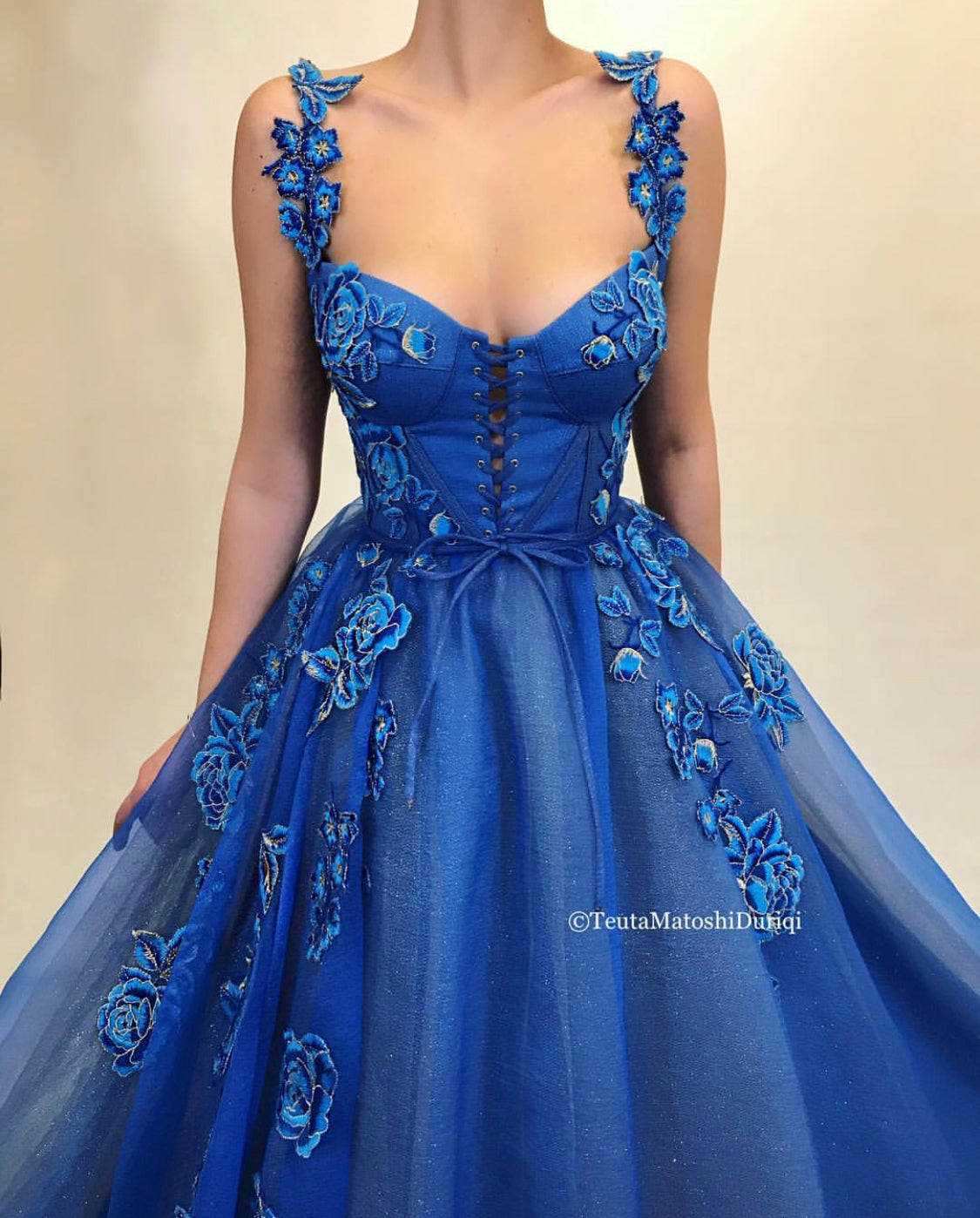 Blue A-Line dress with spaghetti straps and embroidery