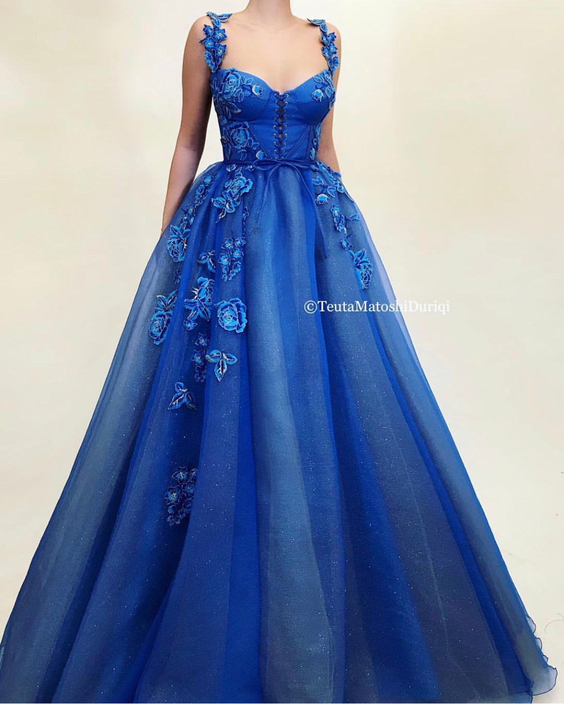 Blue A-Line dress with spaghetti straps and embroidery