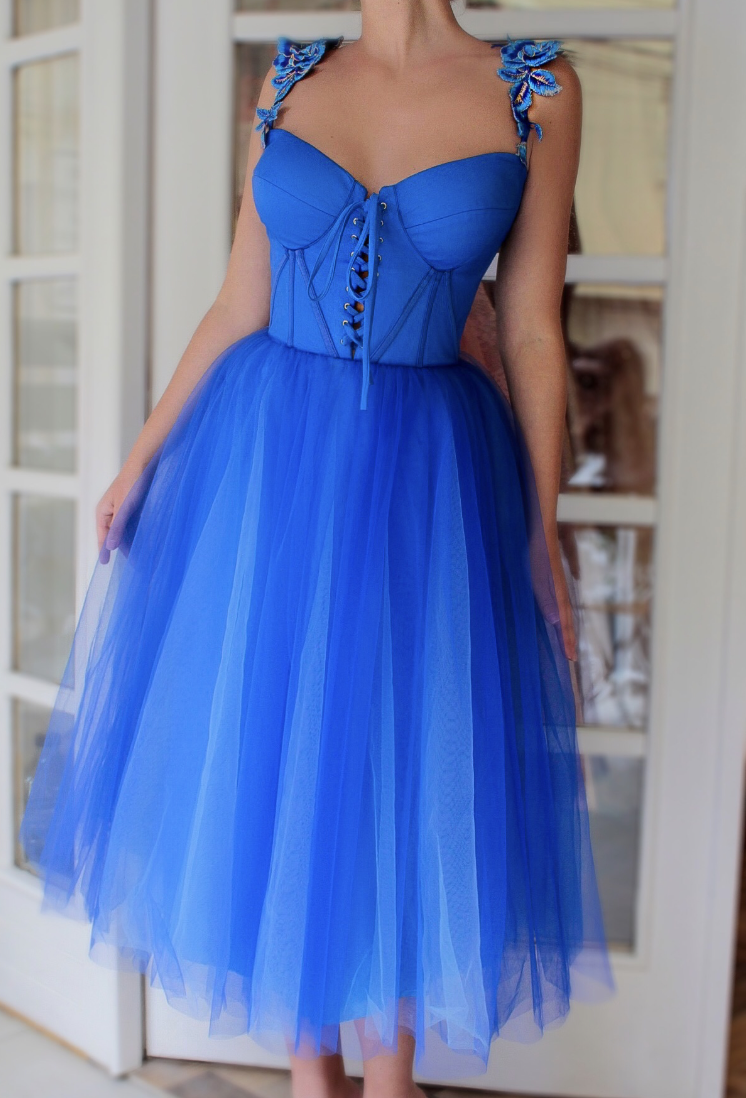 Blue midi dress with spaghetti straps and embroidery
