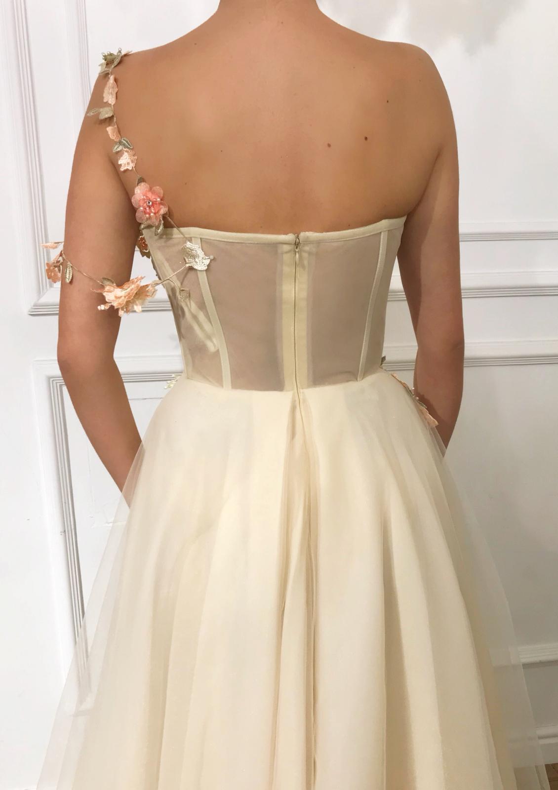 Beige A-Line dress with one shoulder and off the shoulder sleeve, v-neck and embroidered flowers