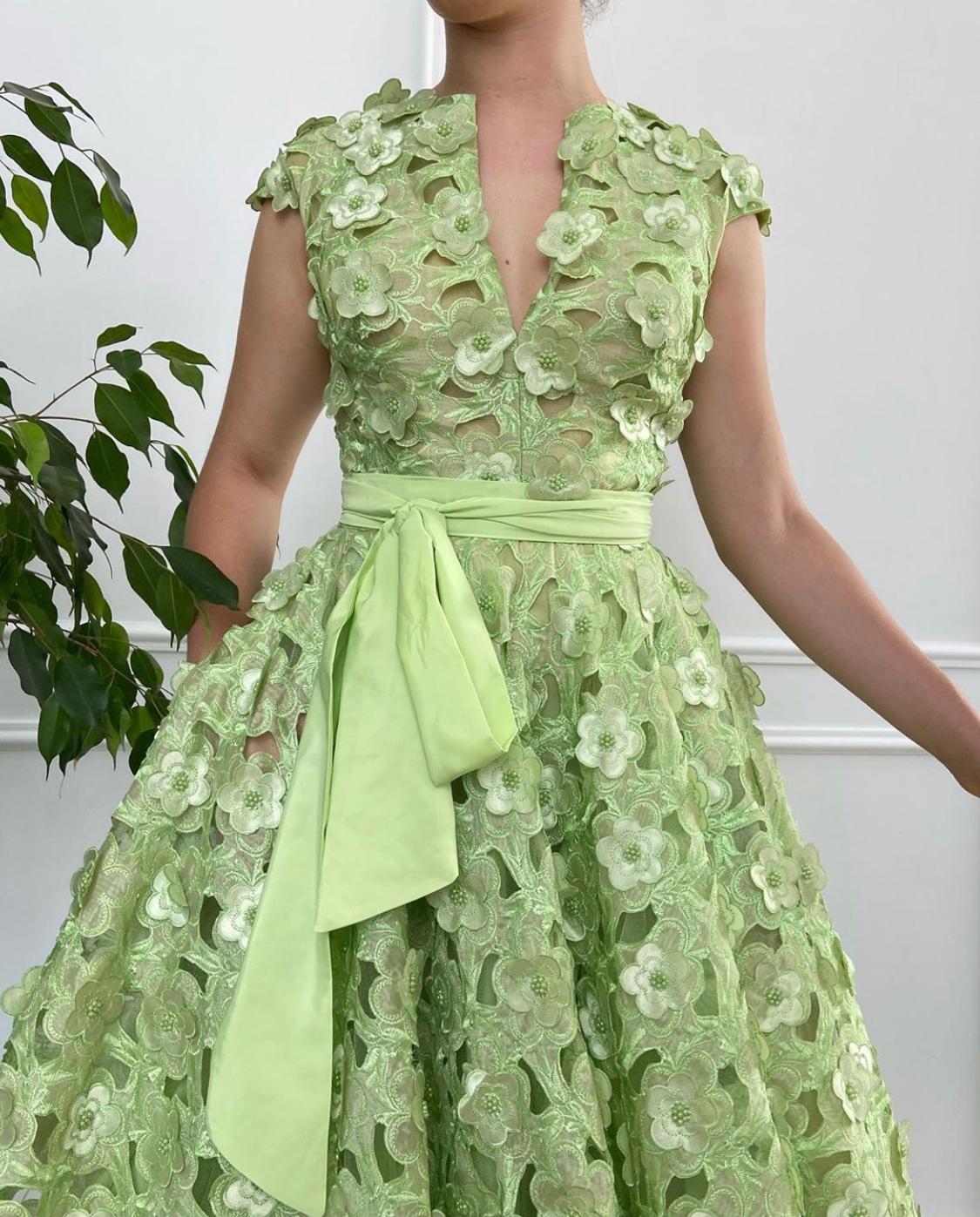 Green A-Line dress with no sleeves and embroidery