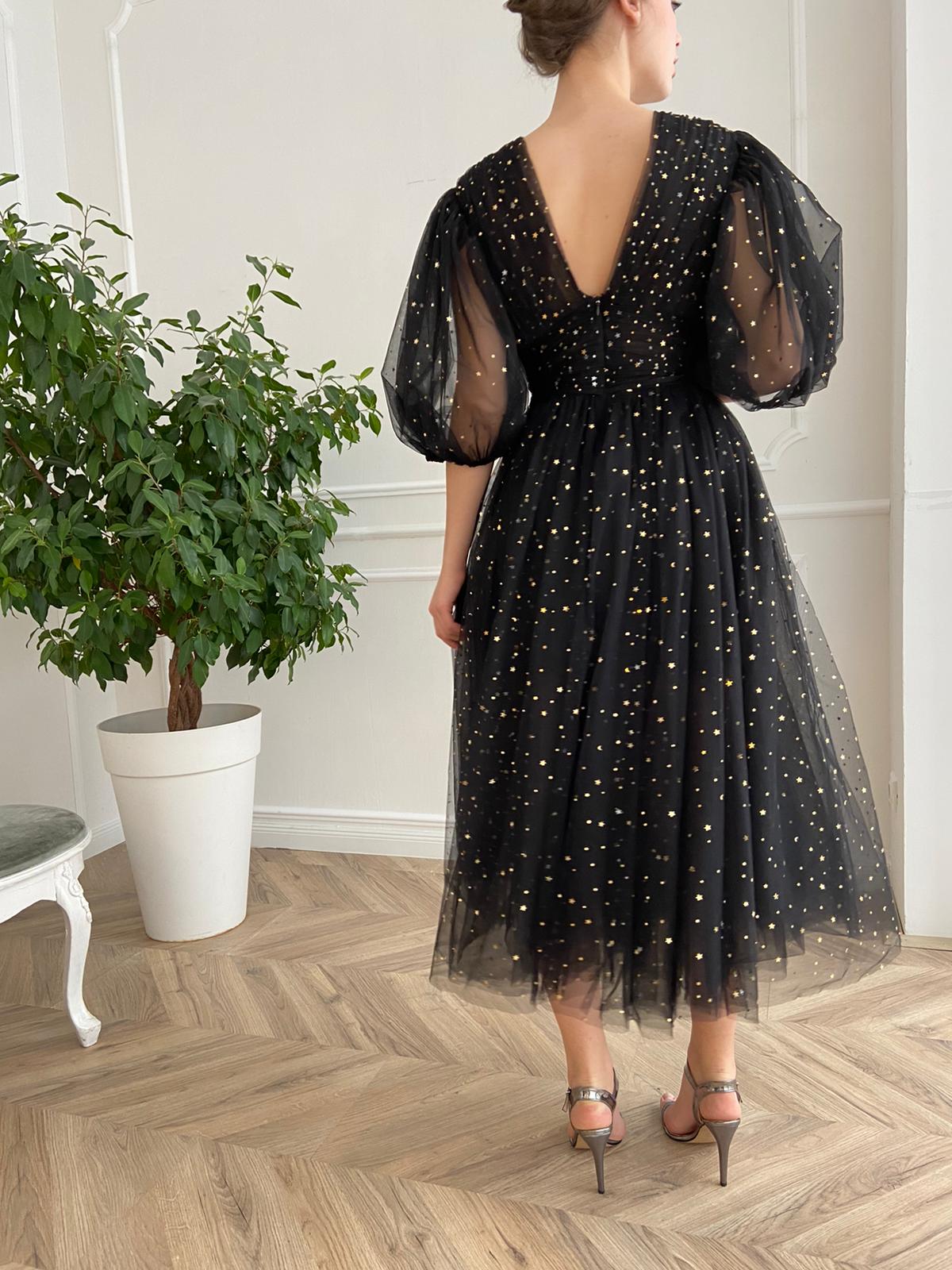 Black midi dress with v-neck, short sleeves and starry fabric