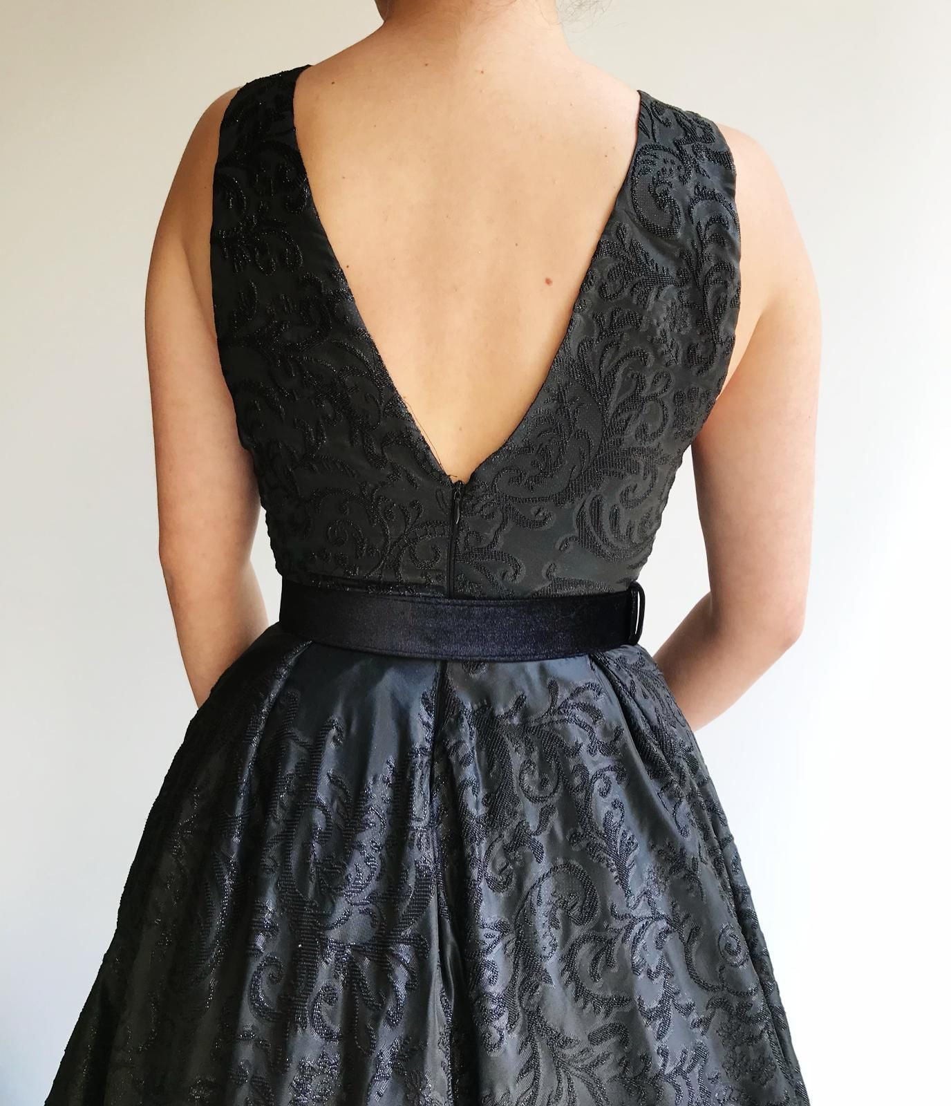 Black A-Line dress with v-neck, no sleeves and embroidery