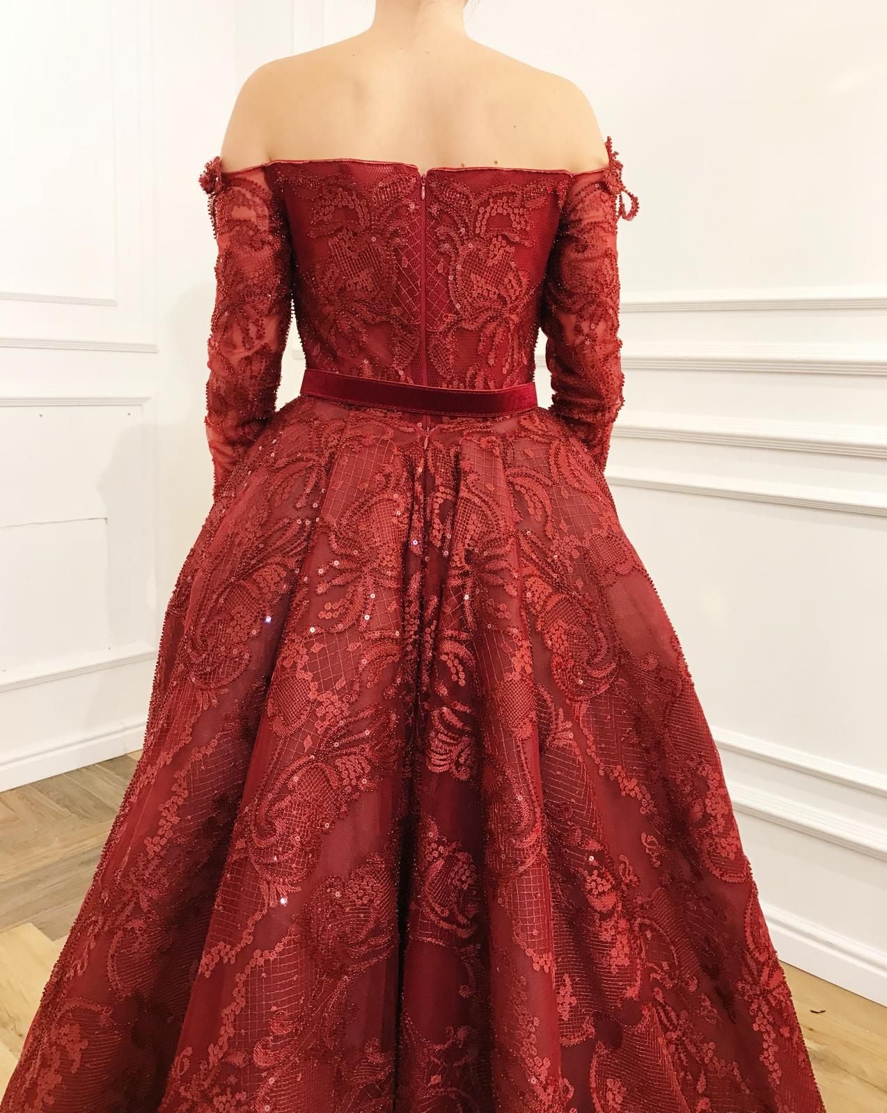 Red overskirt dress with lace, embroidery, belt and long off the shoulder sleeves