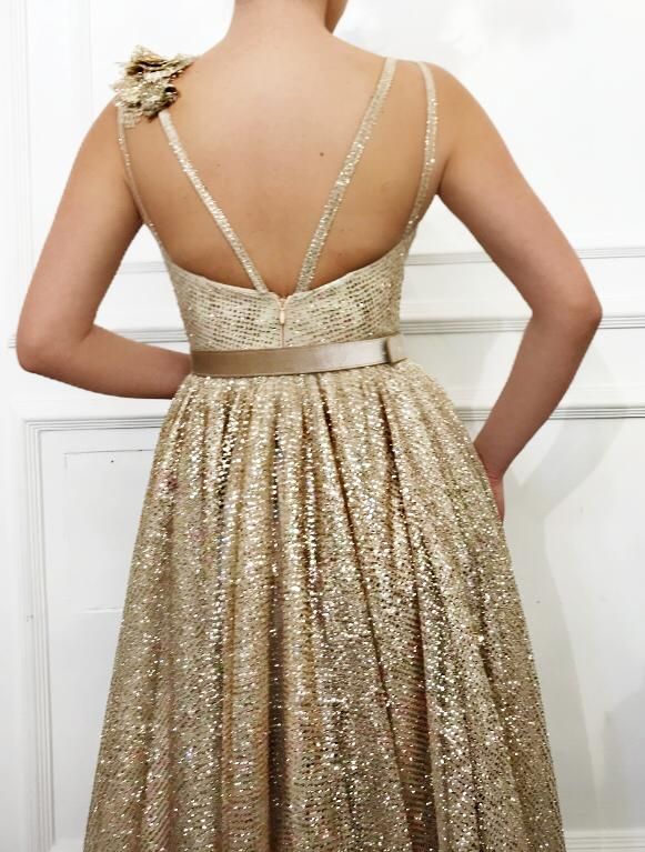 Gold A-Line dress with no sleeves, belt and embroidery