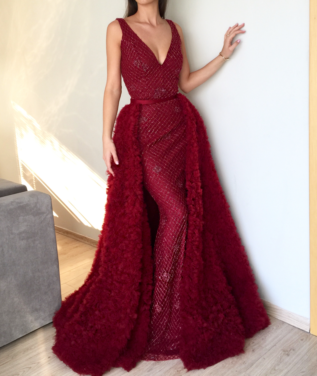 Red overskirt dress with no sleeves and v-neck