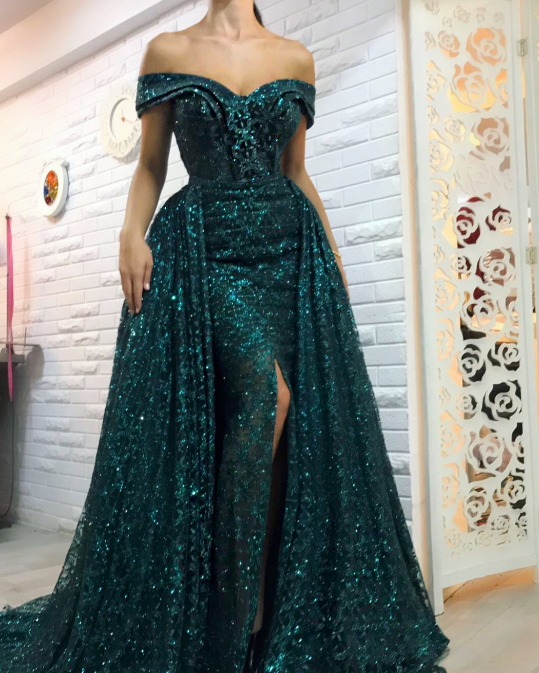 Green overskirt dress with off the shoulder sleeves and embroidery