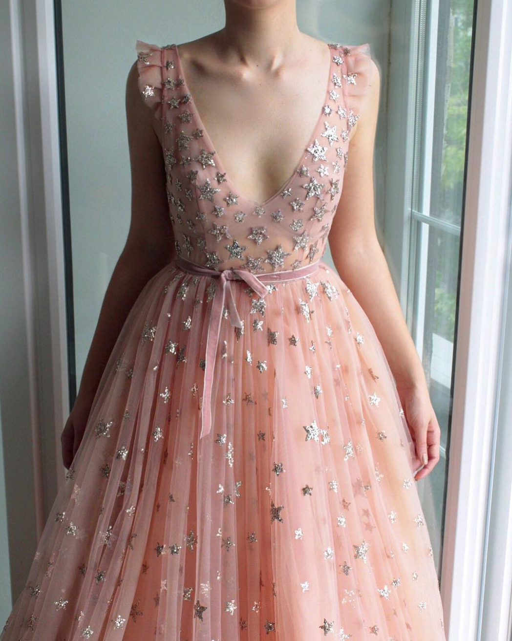 Pink A-Line dress with no sleeves, v-neck and starry fabric