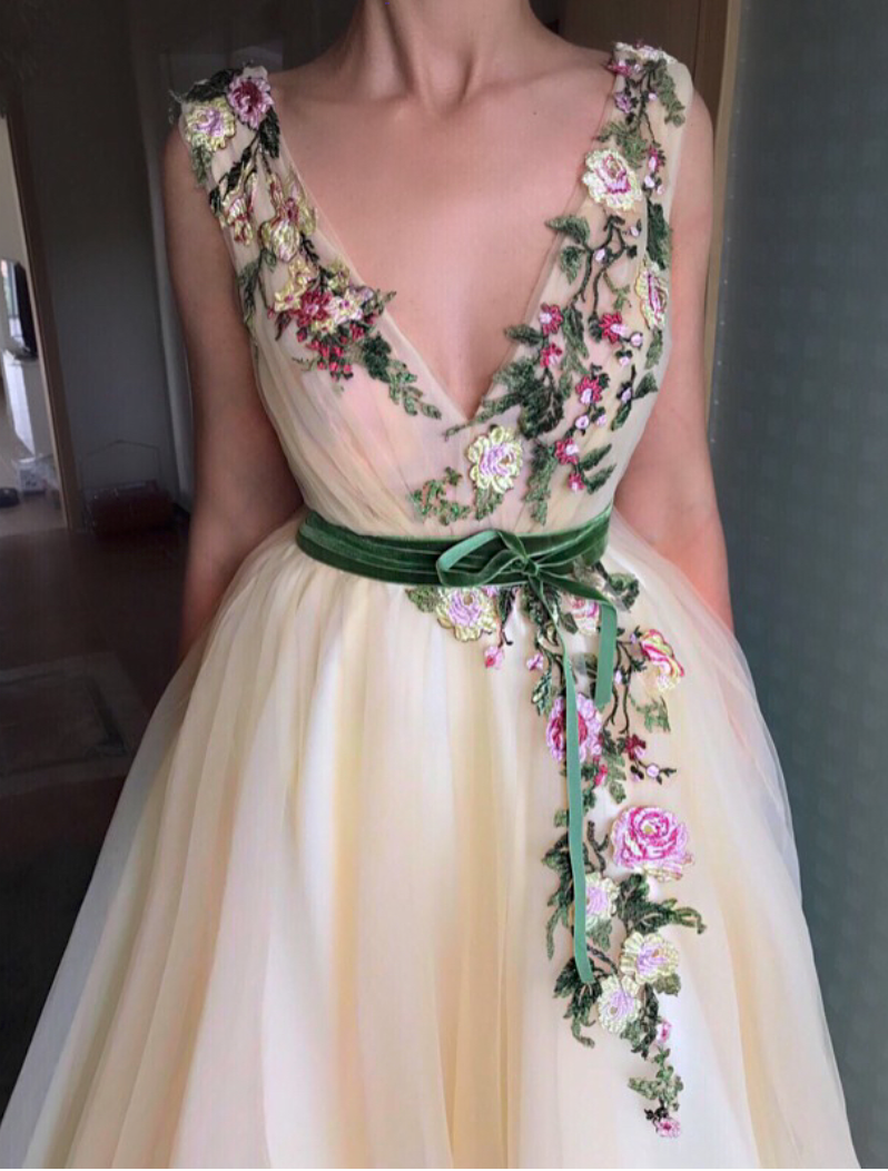 Beige A-Line dress with no sleeves, v-neck and embroidery