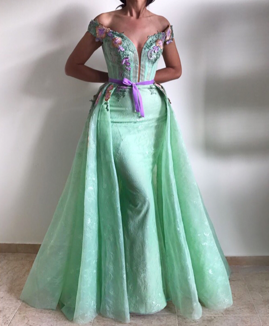 Green overskirt dress with off the shoulder sleeves and embroidery