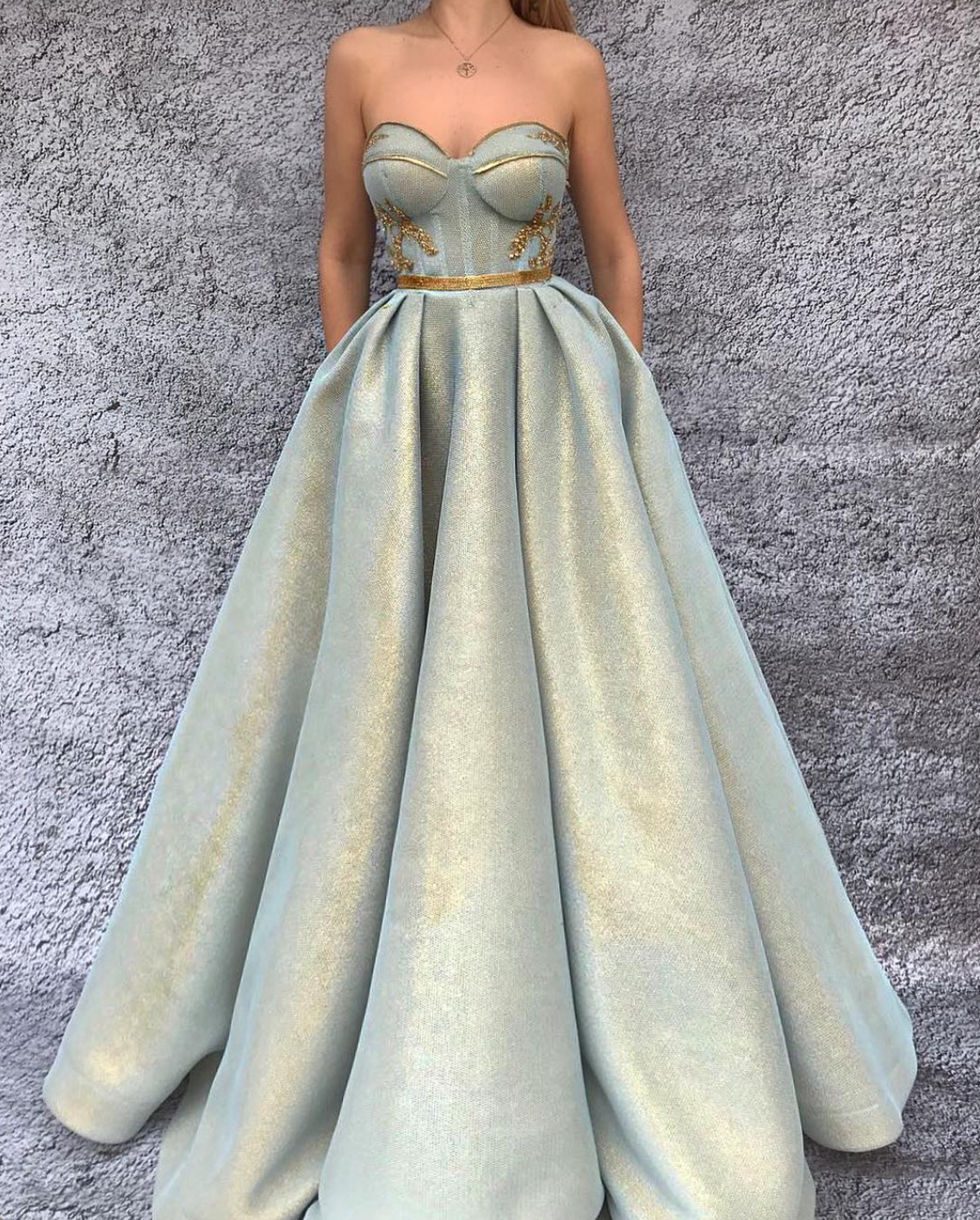 Green A-Line dress with no sleeves and embroidery
