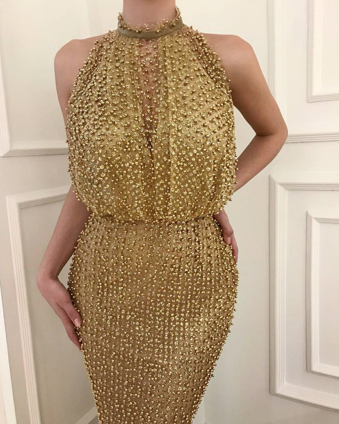 Gold mermaid dress with no sleeves and beading