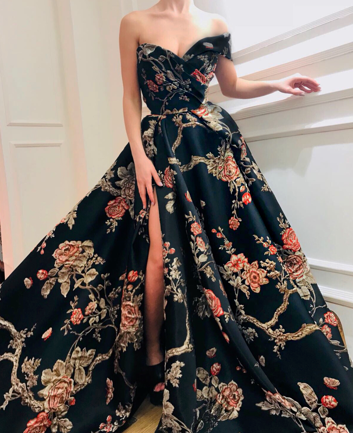 Black A-Line dress with slit, printed flowers and one off the shoulder sleeve