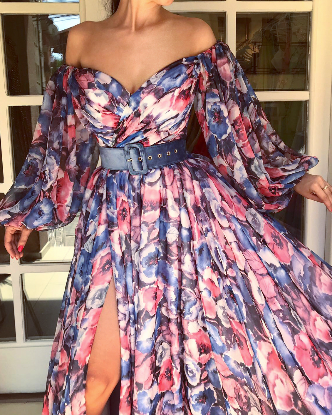 Colorful A-Line dress with long off the shoulder sleeves, belt and printed flowers