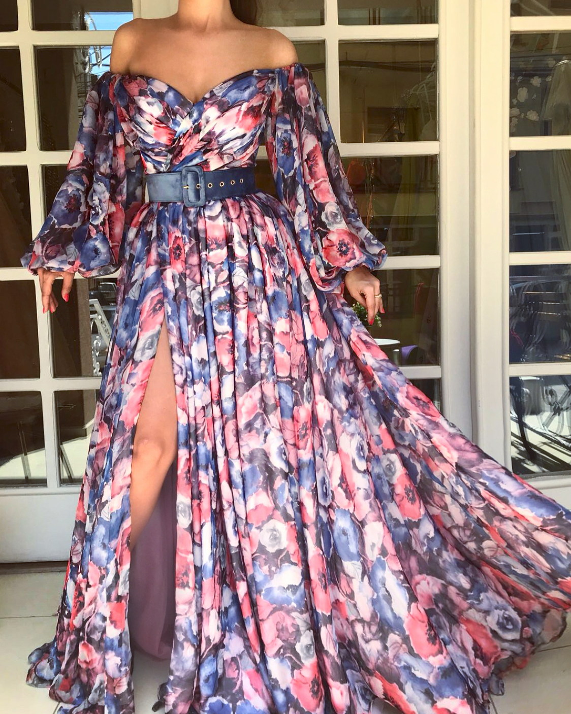 Colorful A-Line dress with long off the shoulder sleeves, belt and printed flowers