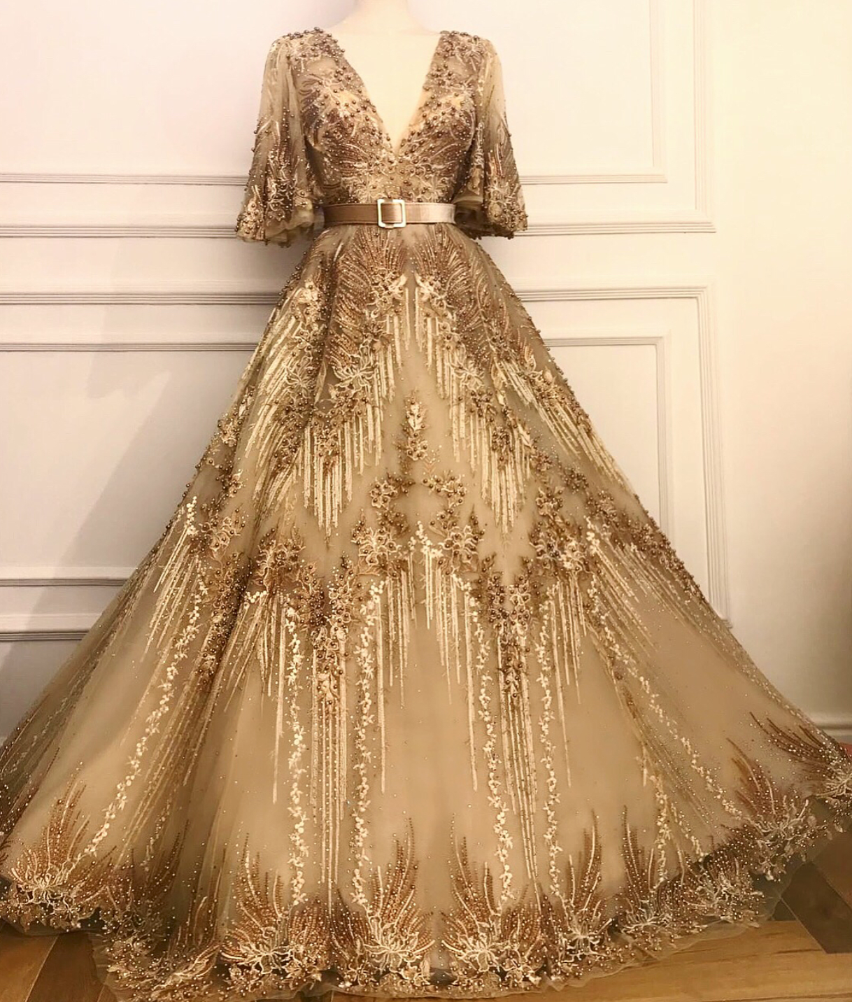 Gold A-Line dress with short sleeves, v-neck and belt