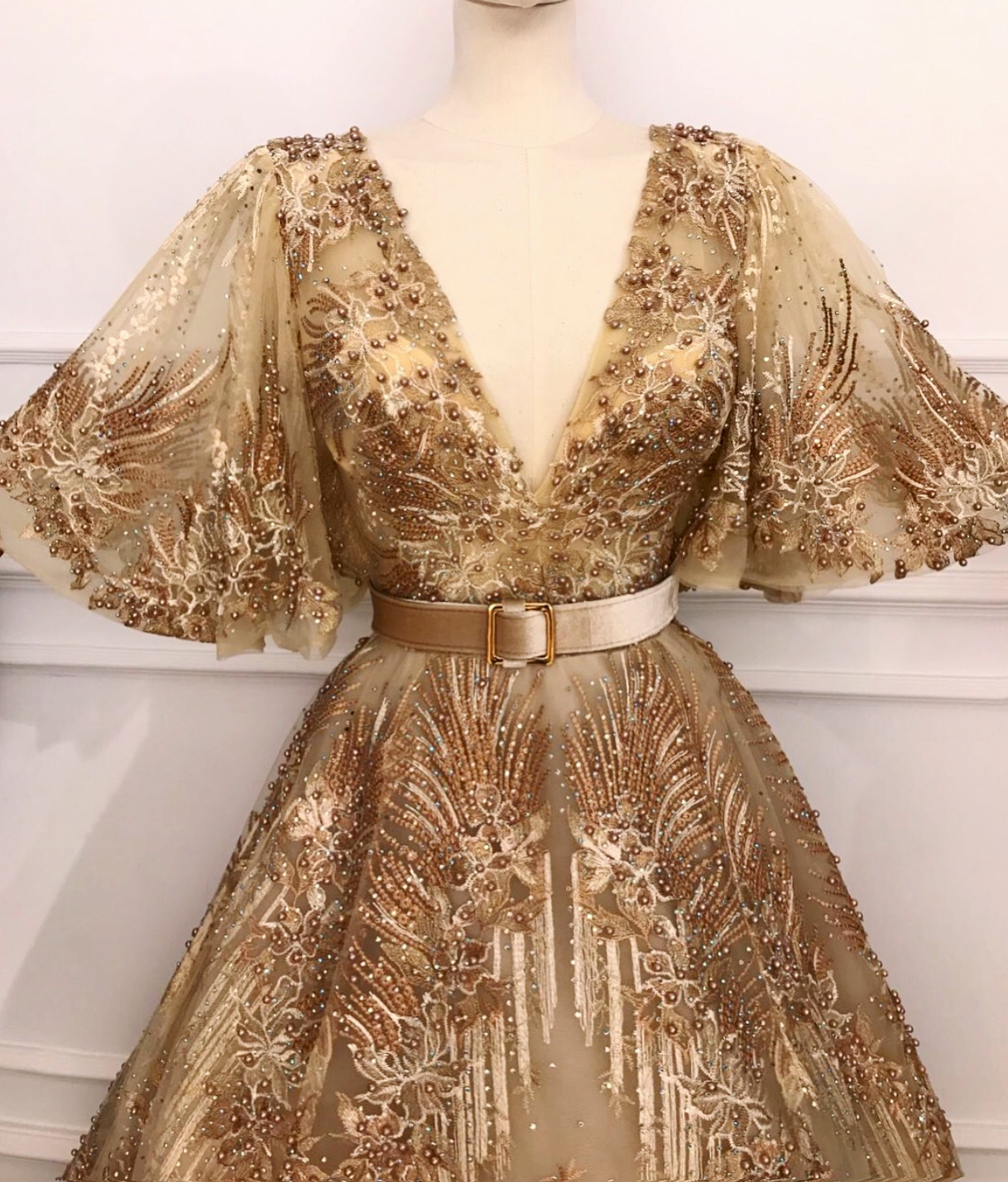 Gold A-Line dress with short sleeves, v-neck and belt