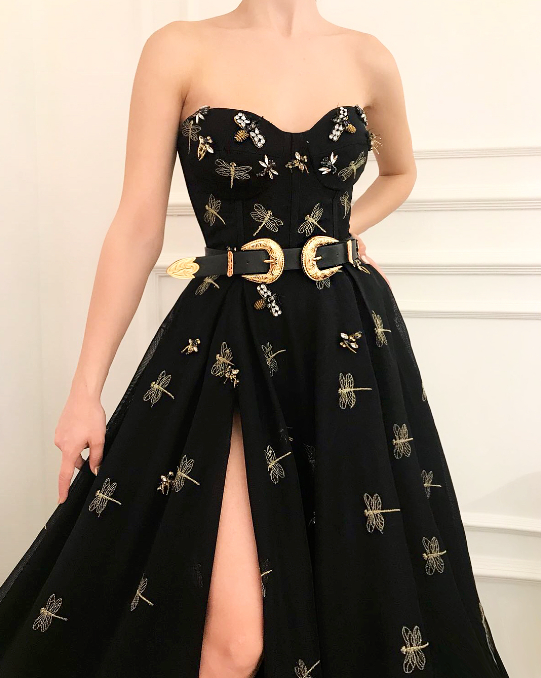 Black A-Line dress with no sleeves, belt and embroidery