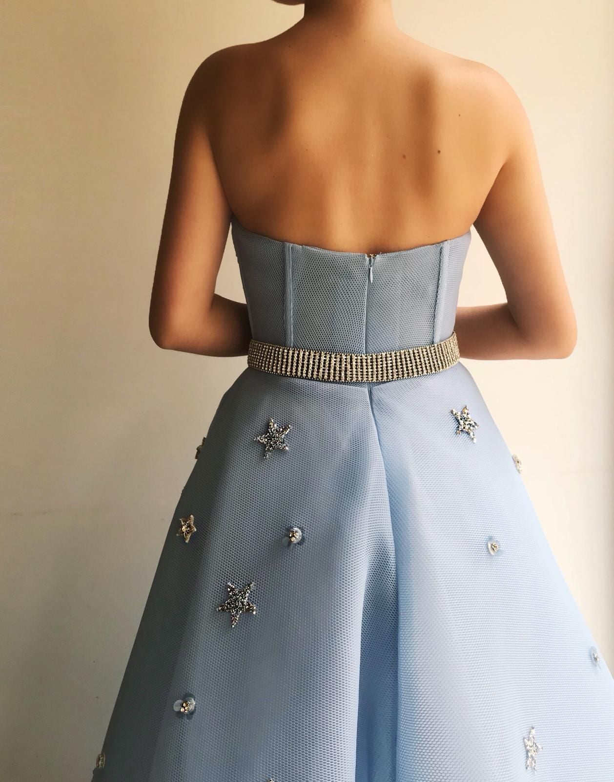 Blue A-Line dress with no sleeves, belt and starry fabric
