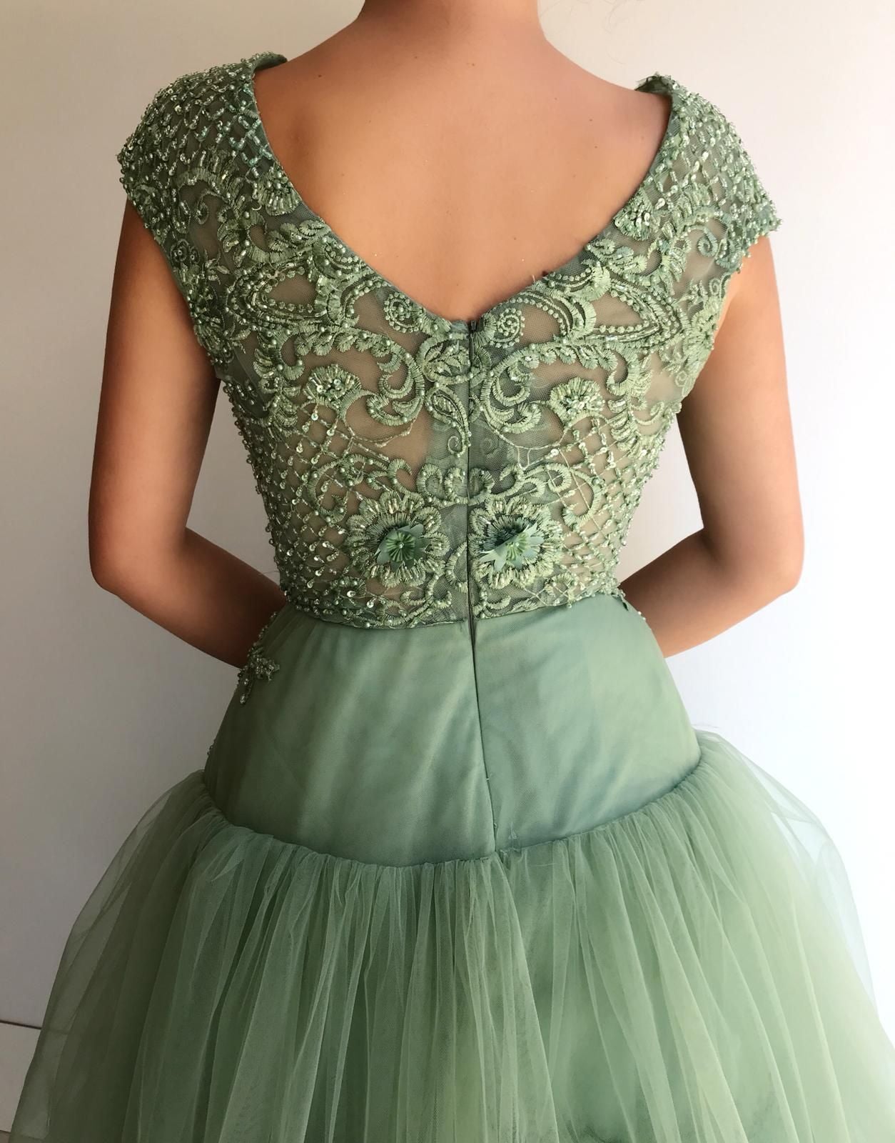 Green A-Line dress with no sleeves, v-neck and embroidery