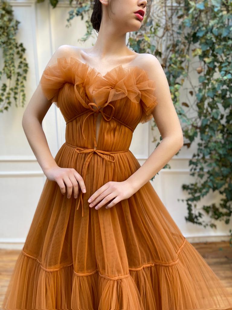 Orange A-Line dress with no sleeves and embroidery