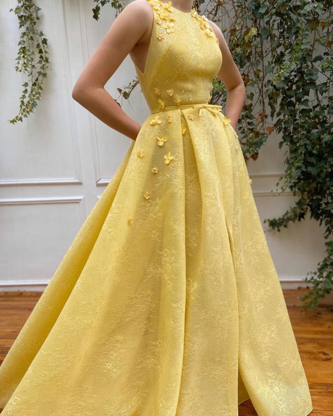 Yellow A-Line dress with no sleeves and embroidery