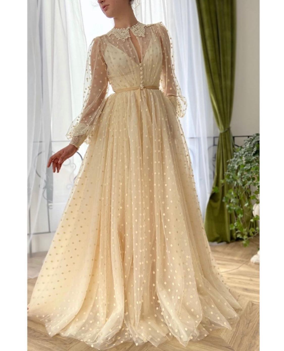 Beige A-Line dotted dress with embroidery and long sleeves