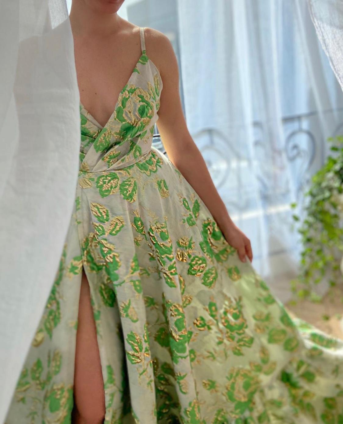 Green A-Line dress with printed flowers, v-neck and spaghetti straps