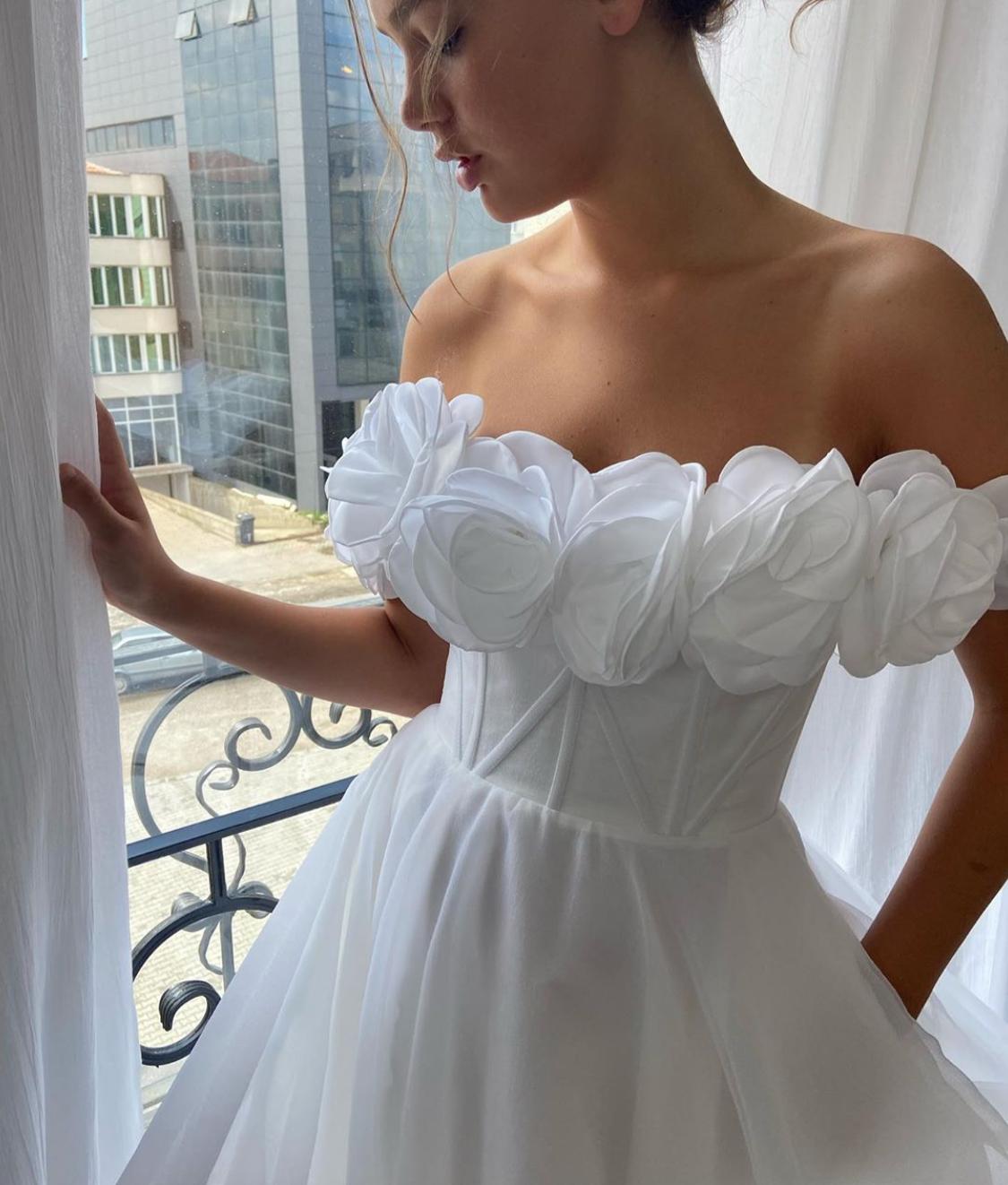 A Line white bridal dress with embroidered flowers and off shoulder sleeves