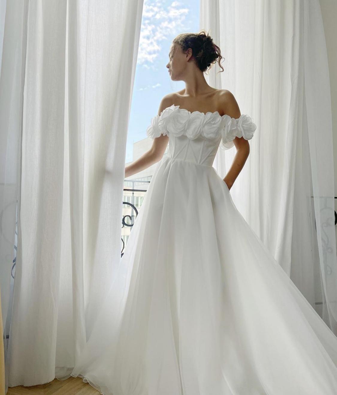 A Line white bridal dress with embroidered flowers and off shoulder sleeves