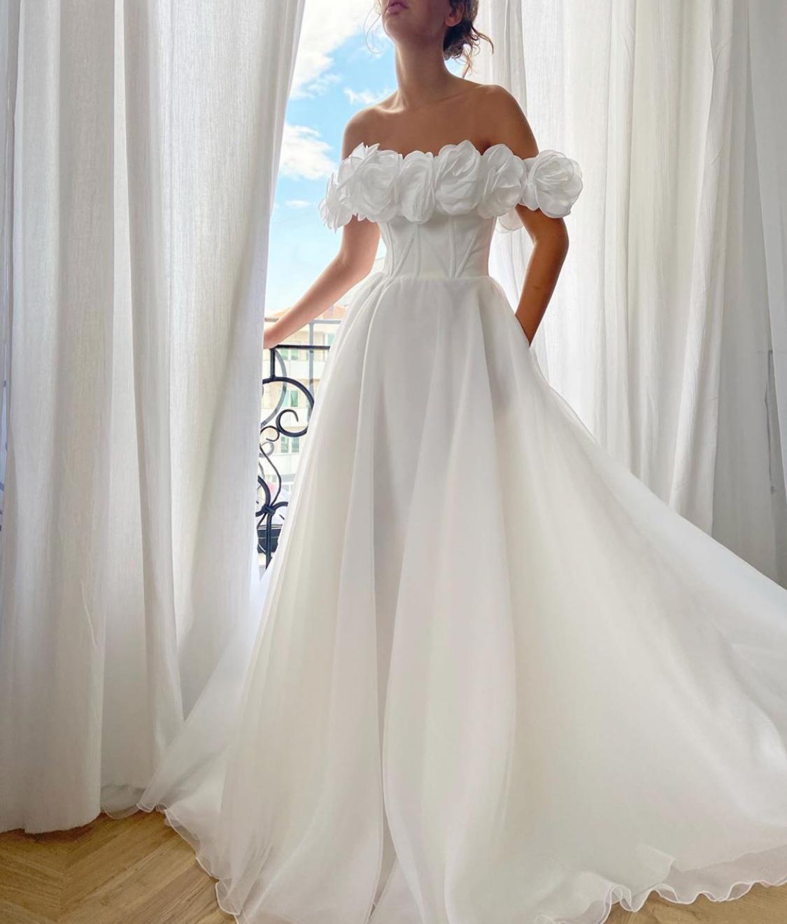 A Line white bridal dress with embroidered flowers and off shoulder sleeves