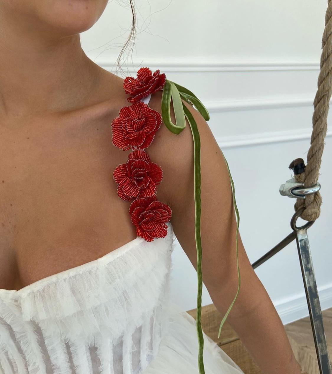 A line white bridal dress with embroidered flowers and spaghetti straps