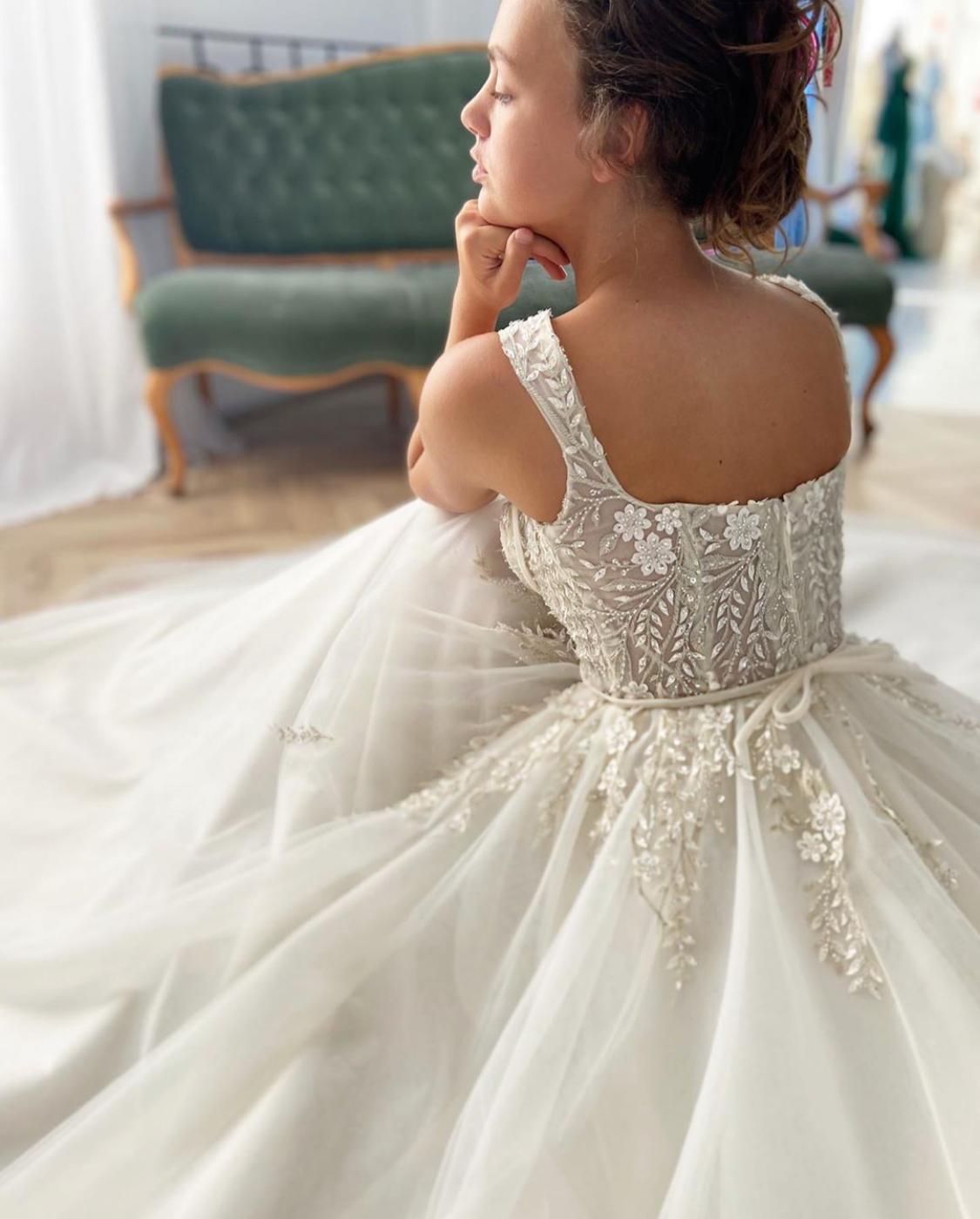 A line white bridal dress with embroidered flowers, straps and train