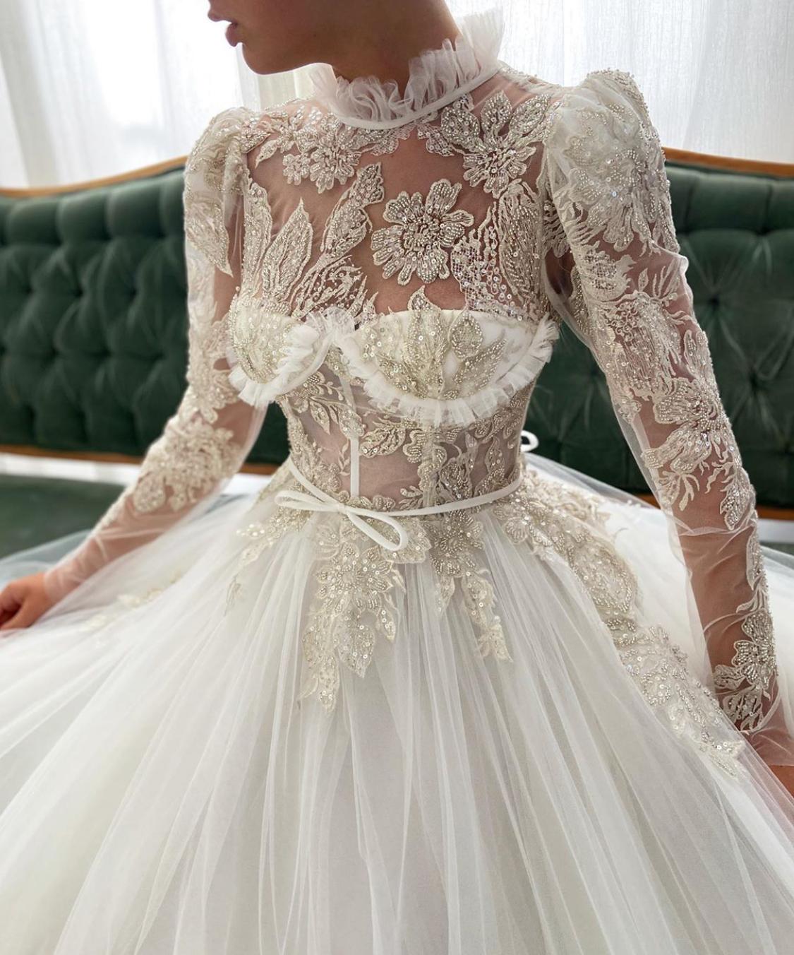 A line white dress with embroidery and long sleeves