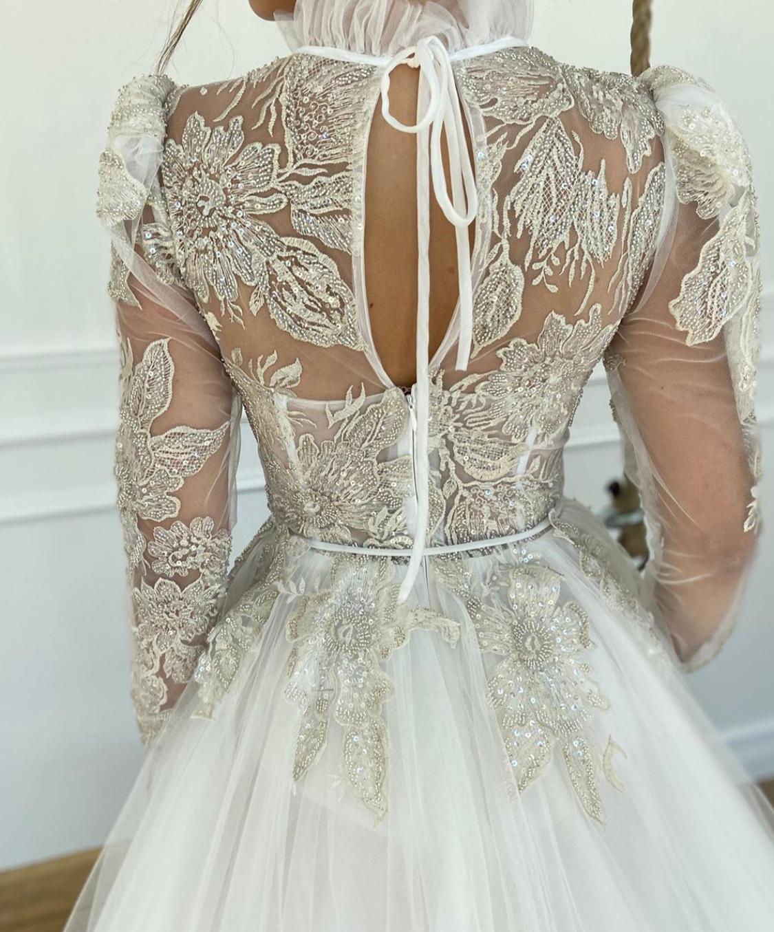 A line white dress with embroidery and long sleeves