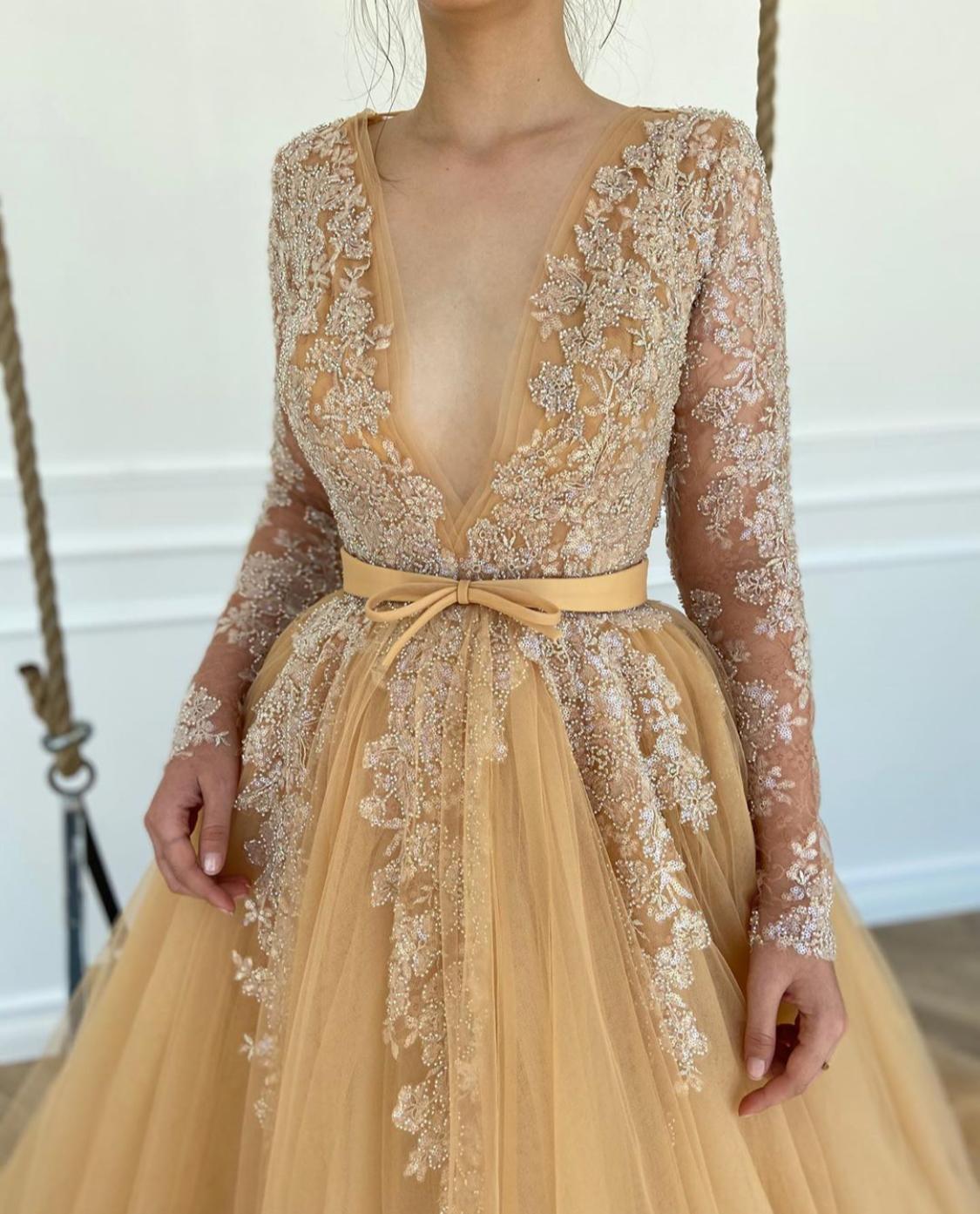 Beige A Line bridal dress with v-neck, long sleeves and embroidery