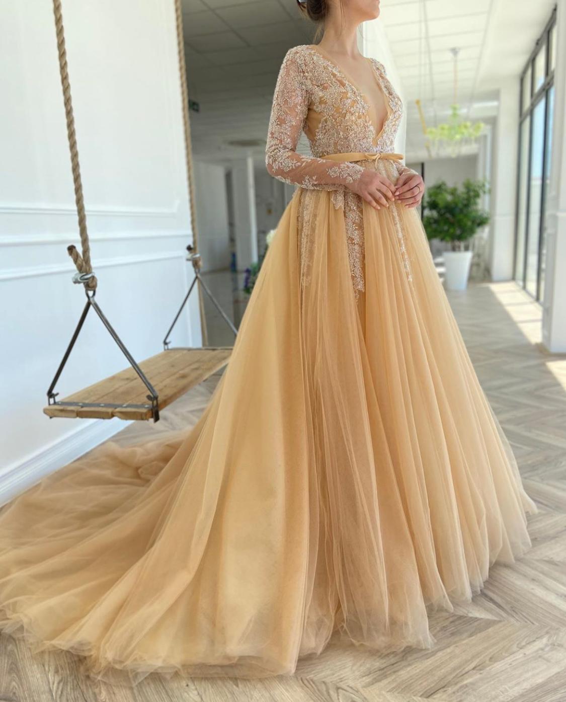Beige A Line bridal dress with v-neck, long sleeves and embroidery