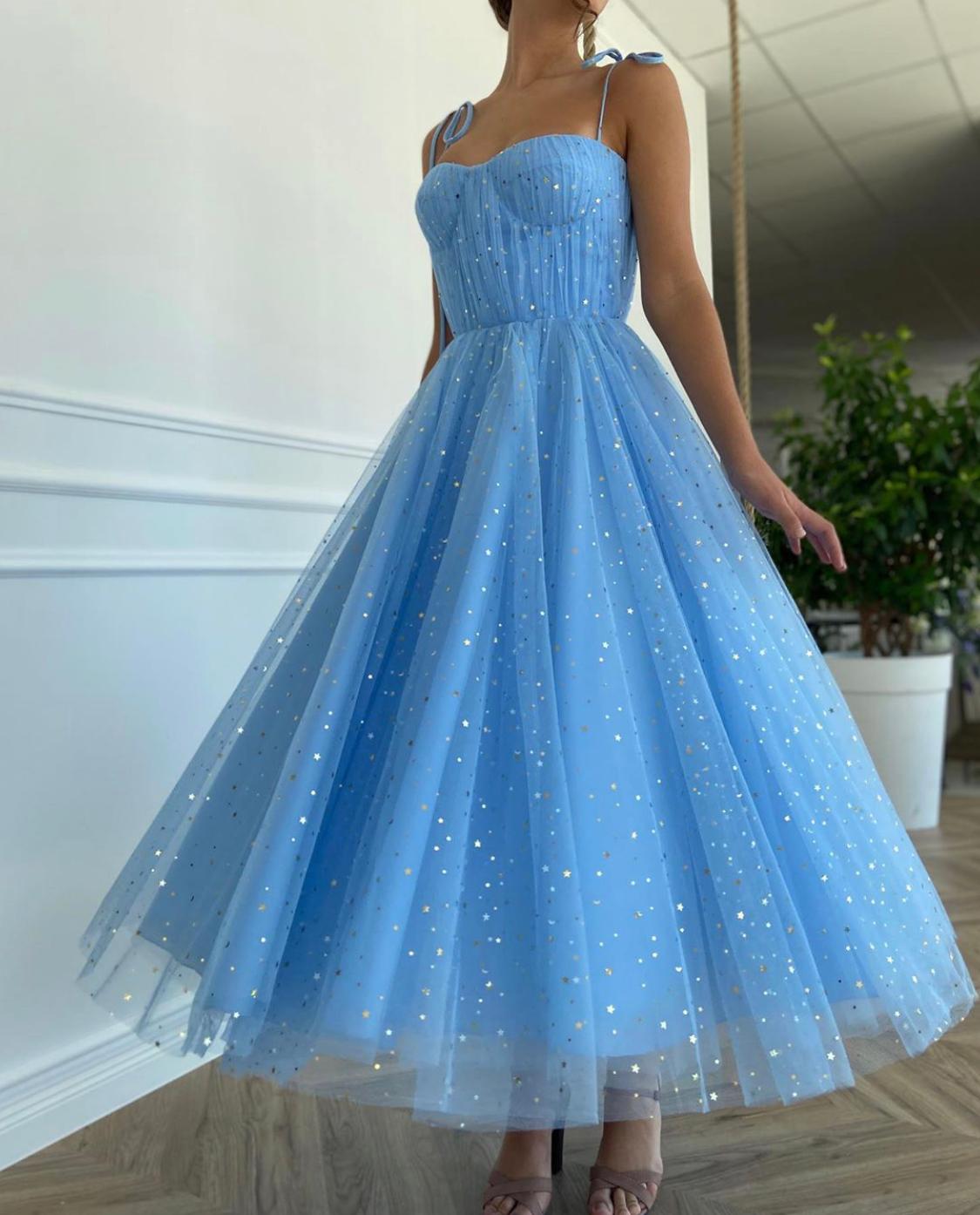 Blue midi dress with spaghetti straps and starry fabric