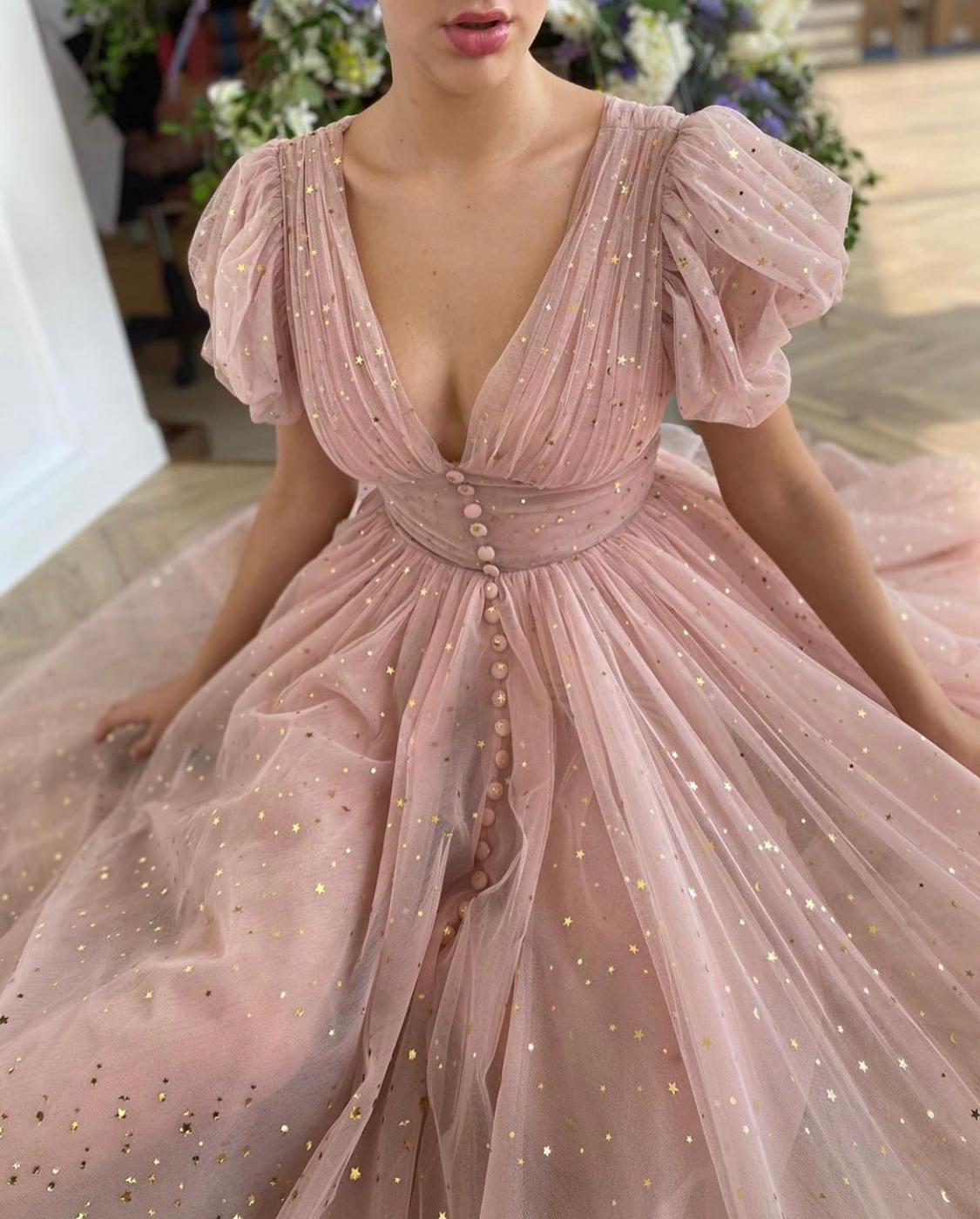 Pink midi dress with v-neck, short sleeves and starry fabric