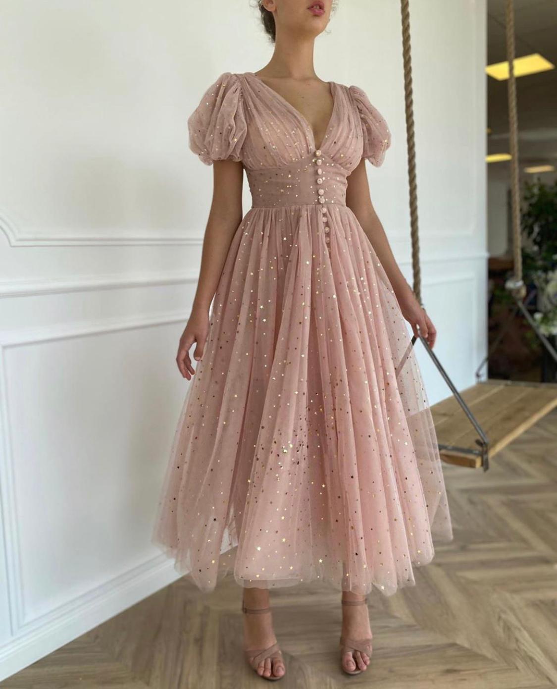 Pink midi dress with v-neck, short sleeves and starry fabric