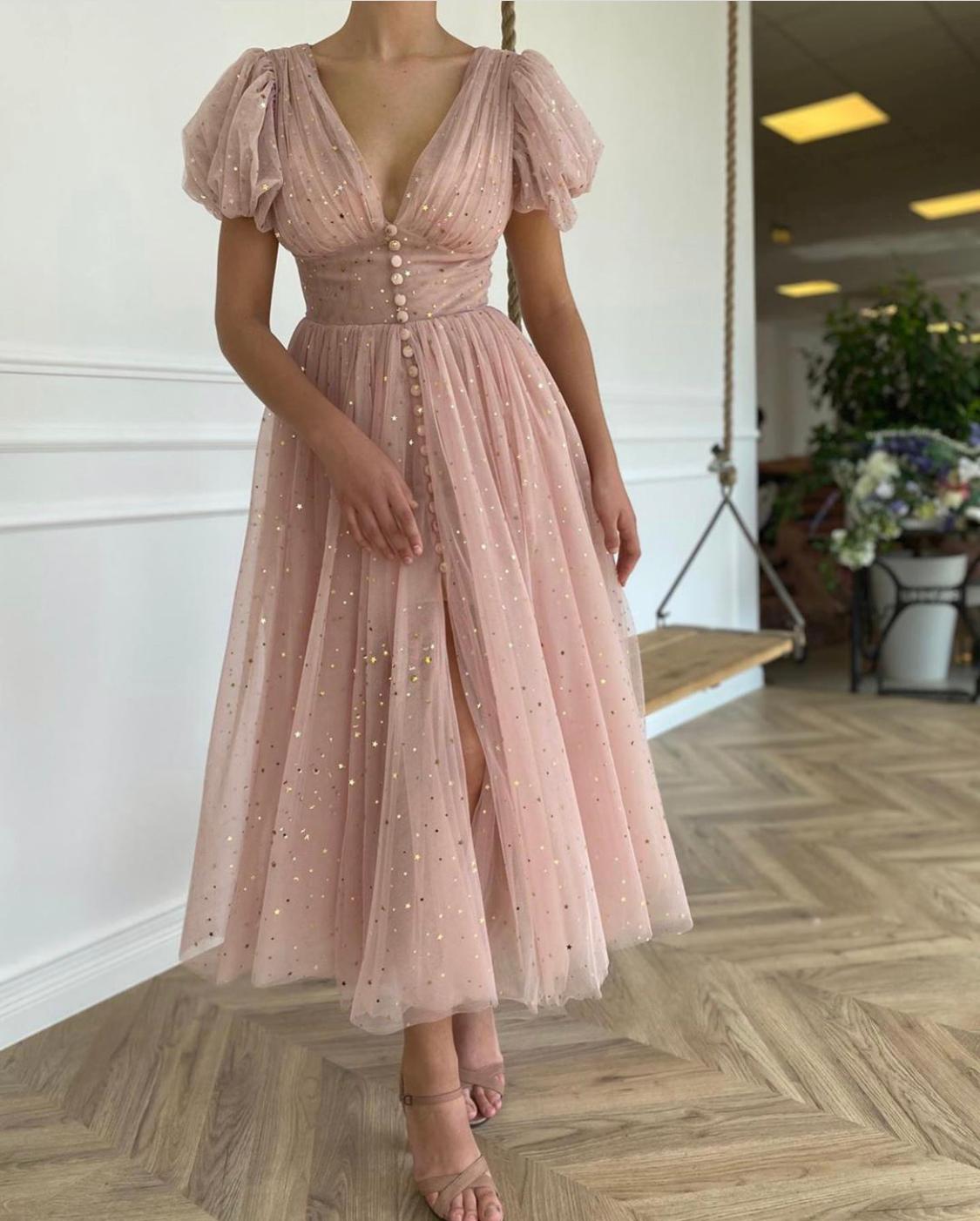 Pink midi dress with v-neck, short sleeves and starry fabric