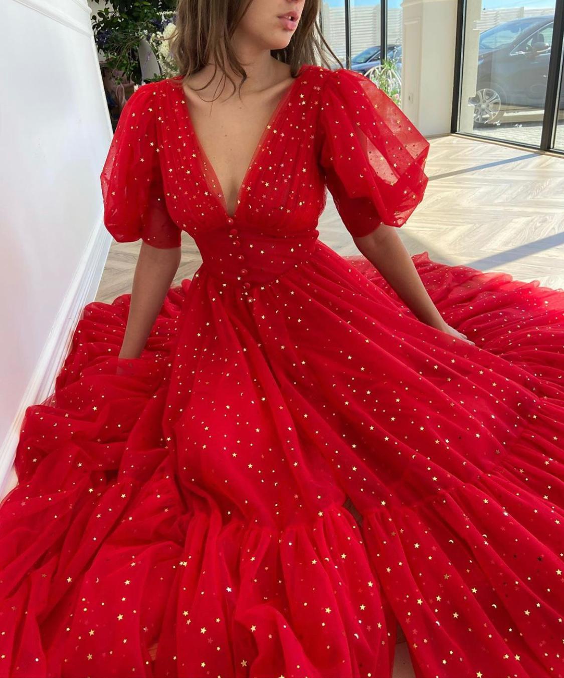 Red midi dress with v-neck, short sleeves and starry fabric