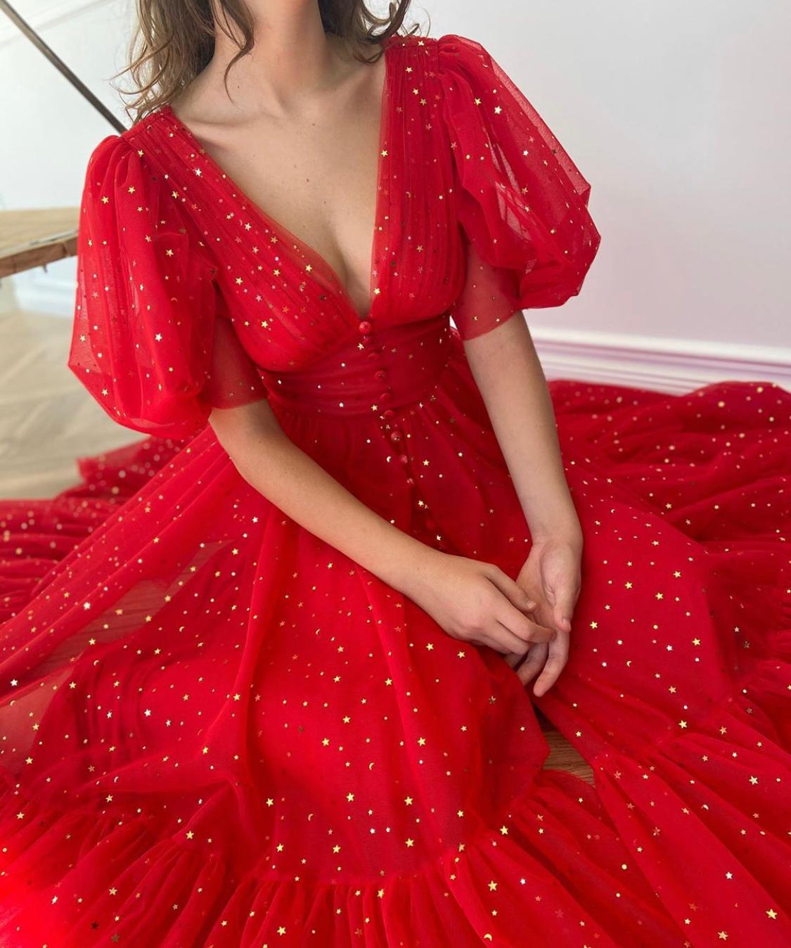 Red midi dress with v-neck, short sleeves and starry fabric