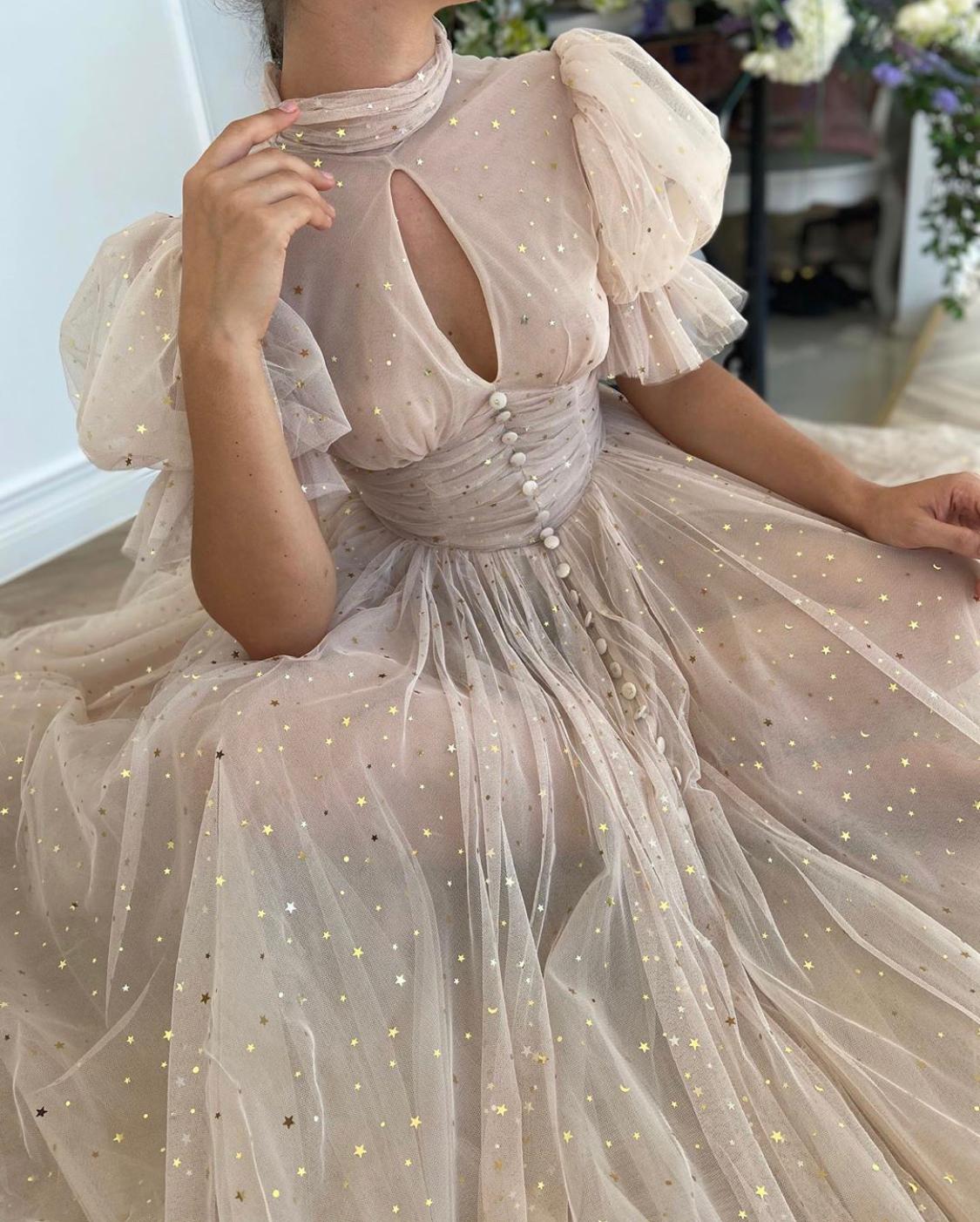 Beige midi dress with short sleeves and starry fabric