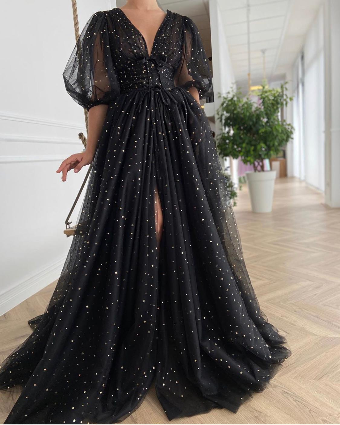 Black A-Line dress with v-neck, short sleeves and starry fabric