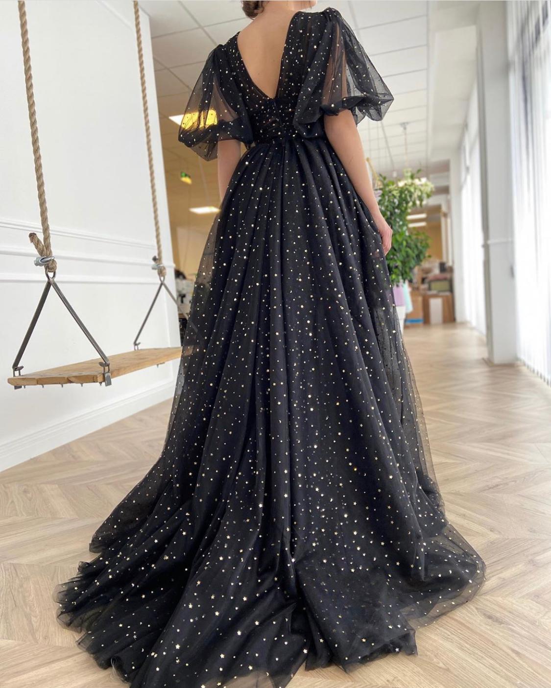 Black A-Line dress with v-neck, short sleeves and starry fabric