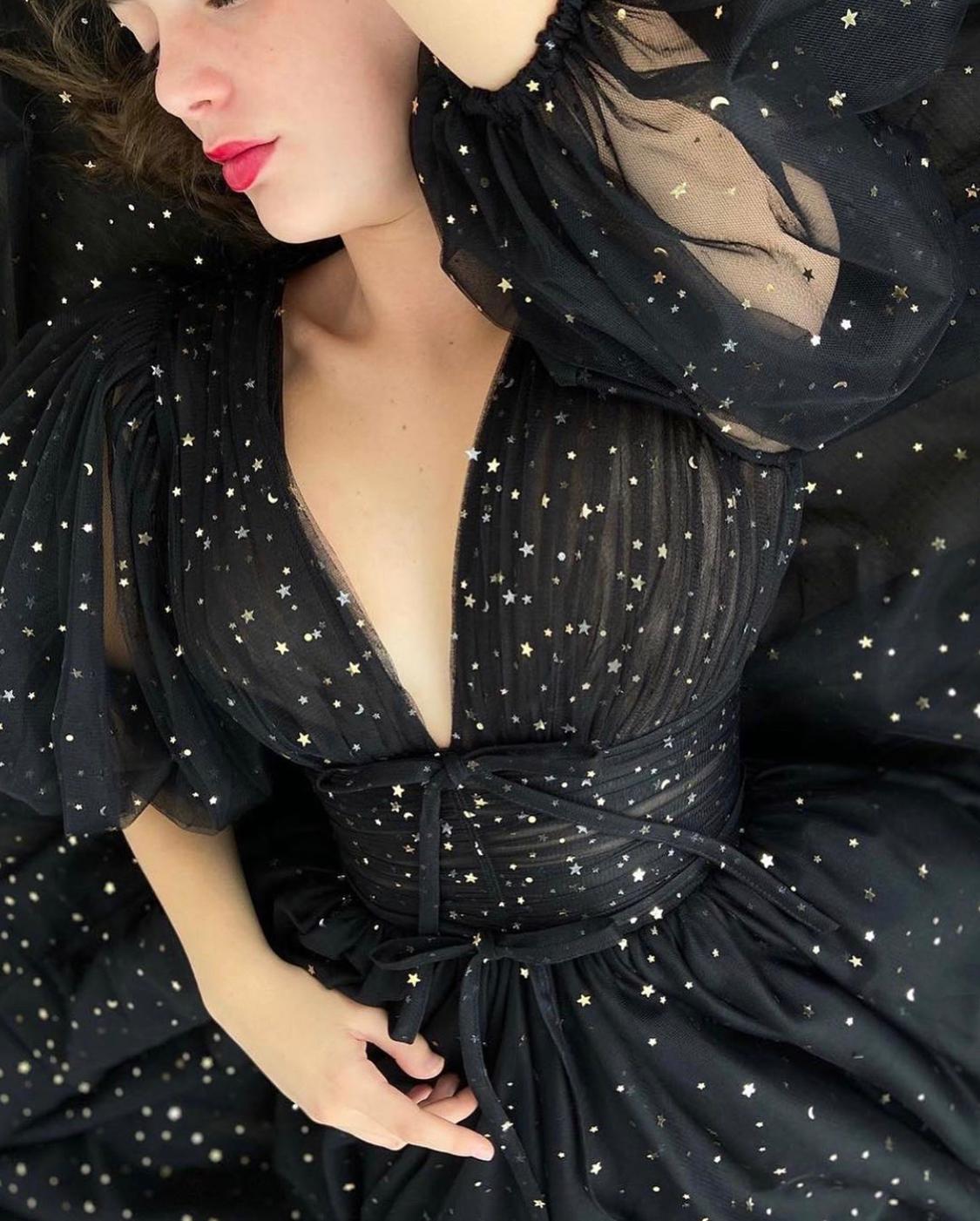Black A-Line dress with v-neck, short sleeves and starry fabric